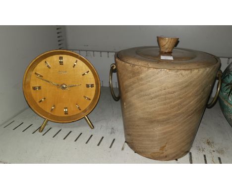 A 1960's Kienzle mantel clock in polished wood case; a polished wood ice bucket with brass handles, 8.5" 