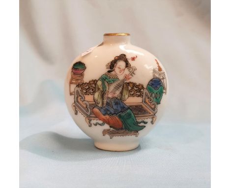 A Chinese porcelain oval scent bottle decorated with female playing a lute, multiple character text on the reverse, red seal 