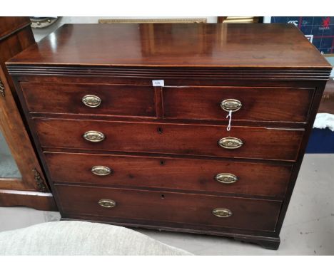 A Georgian boxwood bound mahogany chest of 3 long and 2 short drawers, with brass drop handles on oval back plates, on bracke