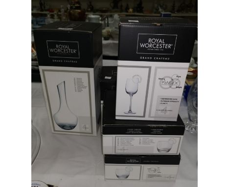 A Royal Worcester "Grand Chateau" glass decanter and 16 matching glasses, in original boxes 
