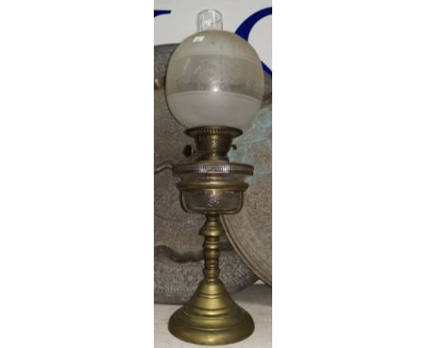 A 19th century brass oil lamp with cut glass reservoir, frosted shade and chimney, 22" 