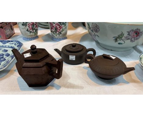 Three Chinese 'Yixing' terracotta teapots with impressed seal marks to bases, lengths 7", 2 x 6" 