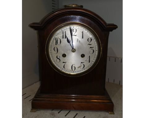 A 1920's Georgian style bracket clock with striking movement, brass ogee feet and handle 