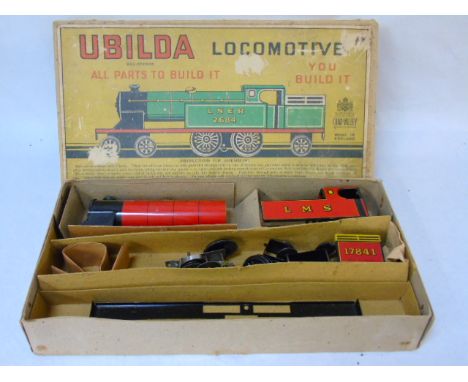 A boxed Chad Valley ubilda locomotive tin plate toy set