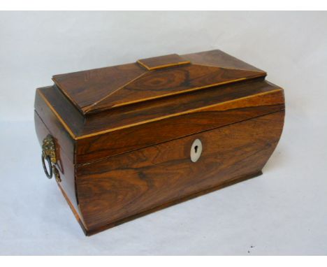 A rosewood tea caddy of sarcophagus form 
