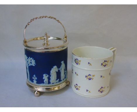 A blue and white wedgewood jasperware biscuit barret and an antique oversized china mug