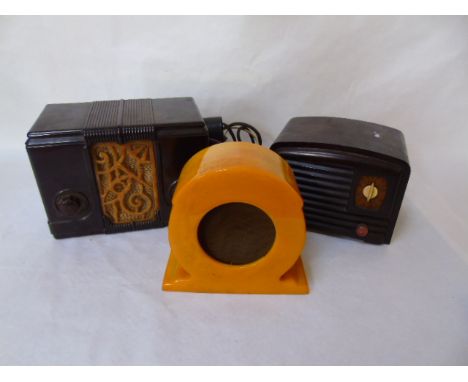2 small early bakelite radios and a bakelite speaker in orange colour,