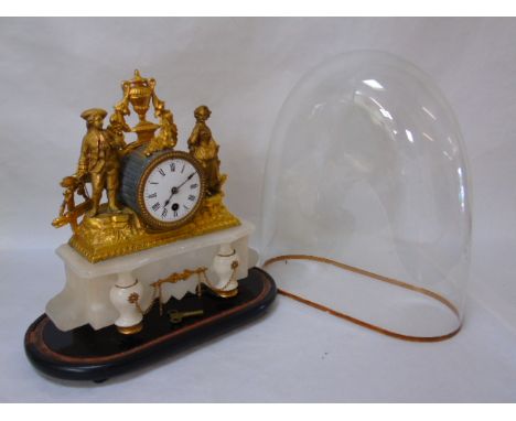 A gilt work clock under dome