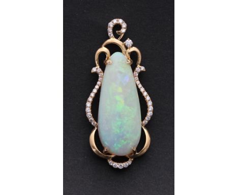 Good Australian free-form opal and diamond 18ct pendant, the opal estimated 6ct approx in an openwork diamond setting, 5.7gm,