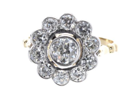 Impressive 18ct and platinum diamond daisy cluster ring, with a central diamond in a surround of ten round brilliant-cut diam