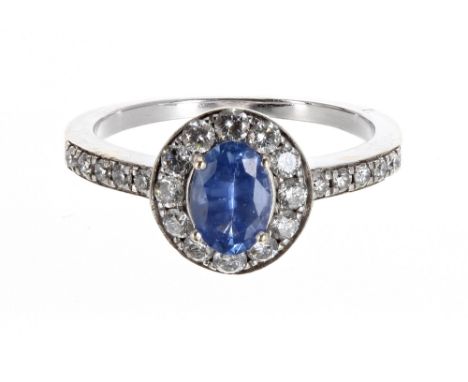 Attractive white gold tanzanite and diamond cluster ring, the tanzanite 0.70ct approx, in a surround of round brilliant-cut d