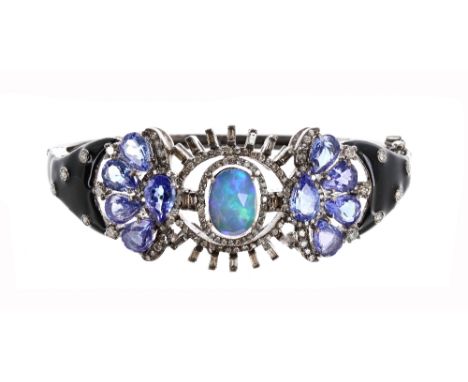 Attractive opal, tanzanite and enamel set silver and black enamelled bangle, oval facet opal in a stylised openwork setting o