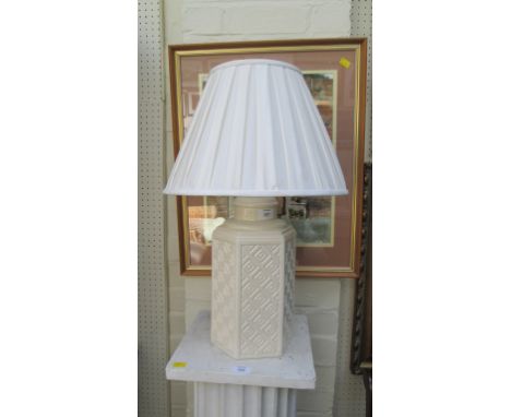 A contemporary French octagonal white ceramic table lamp with pleated shade