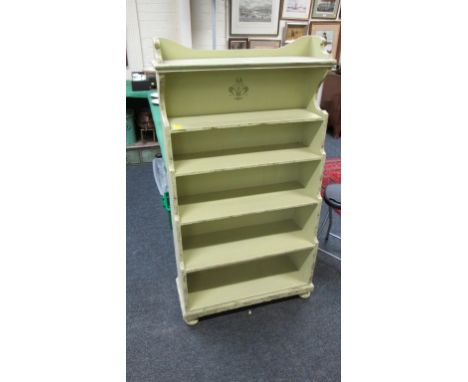 A light green painted six tier 'waterfall' open bookcase