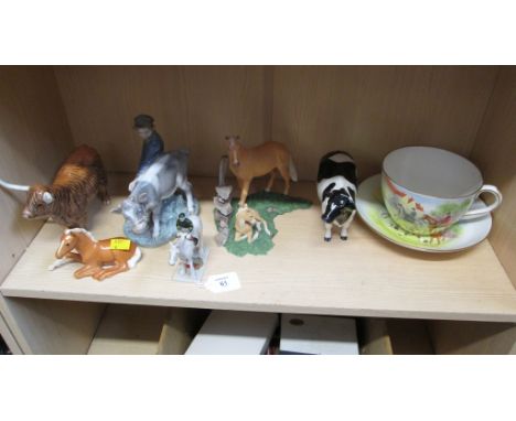 A Royal Crown Derby oversized tea cup and saucer, decorated with a hunting scene, together with two Beswick cattle, a Copenha