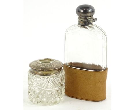 An Edwardian cut glass and silver mounted spirit flask, with associated leather base, Birmingham 1906, and a cut glass and si