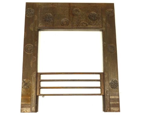 A Victorian aesthetic movement fire surround, after Thomas Jeckyll, decorated overall with flower heads, geometric patterns e