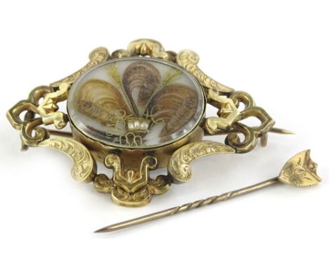 A Victorian memorial brooch and stick pin, the memorial brooch of gilt metal, with central oval memorial panel, 5.5cm W, the 