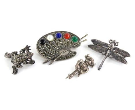 Four silver brooches, to include a Lincoln Imp, a silver artist easel set with marcasite and coloured dots, a marcasite set f