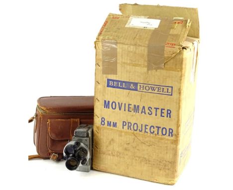 A Movie Master 8mm cine projector, in original packaging, and a hand held cine camera.