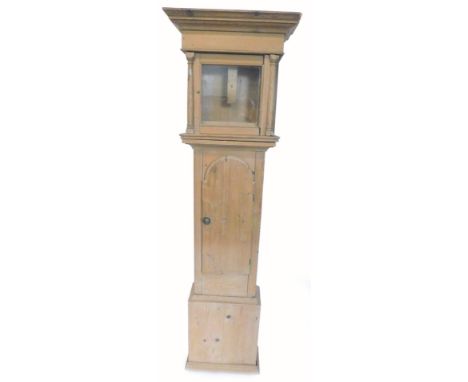 A pine longcase clock case, with a glazed door, flanked by part turn pilasters and an arched door, 198cm H.