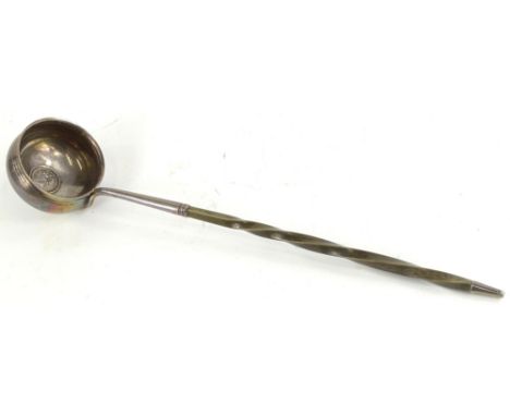 A 19thC silver plated ladle, inset to the base with a George IV silver coin, with twisted whale bone handle, 32cm L.