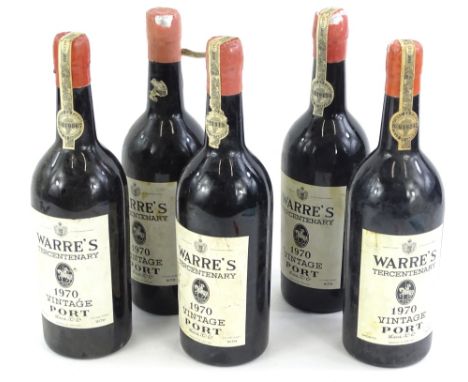 Five bottles of Warre's tercentenary 1970 vintage port.