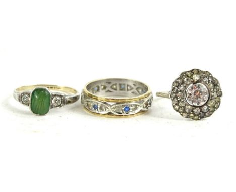 Three dress rings, to include a 9ct gold eternity ring, set with blue and white stones, a 9ct gold and silver Art Deco dress 