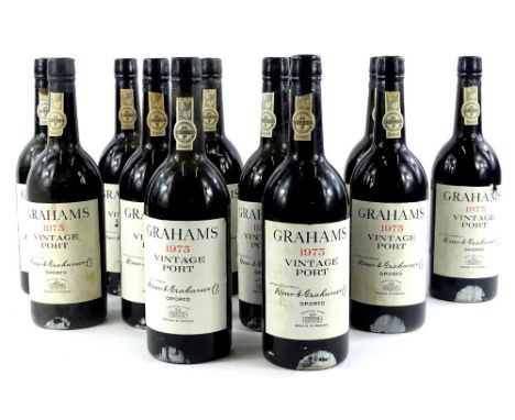 Twelve bottles of Graham's 1975 vintage port, all still fully sealed, some labels. (AF)
