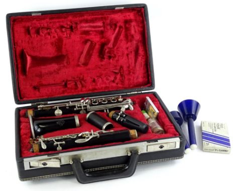 A Le Blanc black Bakelite or plastic clarinet, in various pieces with accessories etc., and a fitted case.