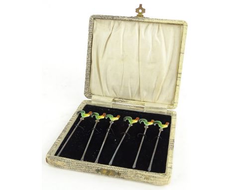 A set of six continental white metal cocktail sticks, each decorated with a coloured enamel cockerel, stamped sterling silver