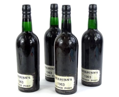 Four bottles of Cockburn's 1963 vintage port.