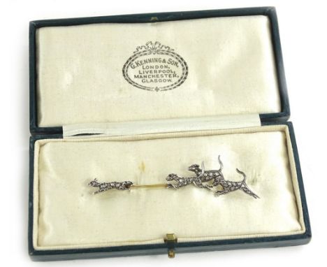 A diamond set fox and hound brooch, depicting a fox being chased by three hounds, each animal set with tiny diamonds to the b