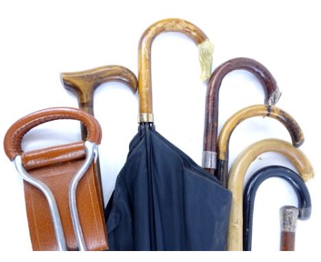 Various silver mounted walking sticks, a walking cane, shooting stick and umbrella combination etc.