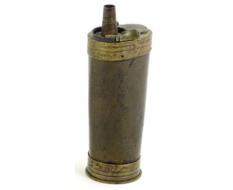 A 19thC brass shot or powder flask, 13cm H.