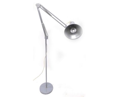 An Anglepoise type floor lamp, with grey painted decoration on a circular base. 
