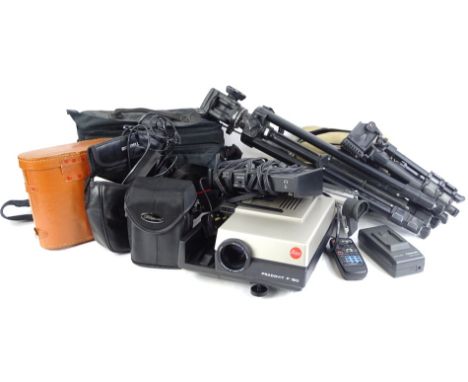 Various items of camera equipment, to include a Lyca Pradovit P150 projector, various tripods, camera accessories, etc.