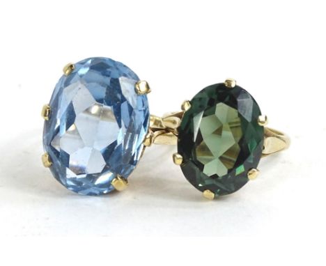 Two 9ct gold stone set dress rings, one set with aquamarine, the other set with green stone, each in claw setting on plain ba