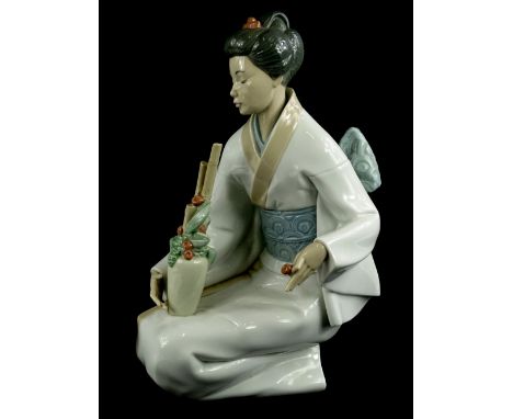 A large Nao porcelain figure of an oriental lady with a vase etc., 33cm H, boxed.