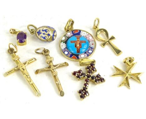 A quantity of pendants, to include two 9ct gold crucifixes, 3.1g, a garnet set silver gilt pendant, a gold onyx pendant, a 9c