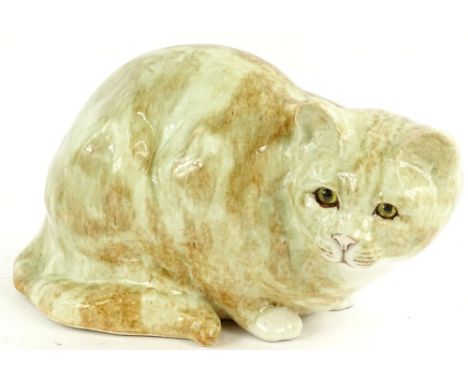 A Winstanley ceramic model of a crouching ginger tom cat, scripted mark to underside, number 5, 33.5cm W.