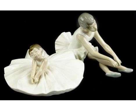 Two Nao ballerinas, each seated, both boxed.