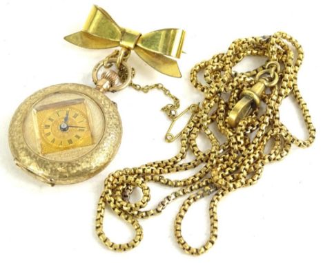 A 9ct gold fob watch, on bow brooch, the fob watch with small circular dial inserted in the centre of a diamond shape, in an 