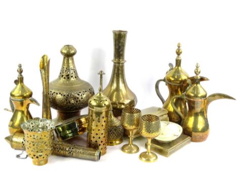A large quantity of brassware, mainly Middle Eastern, to include coffee pots, a lamp base, vases, onyx eggs, etc.