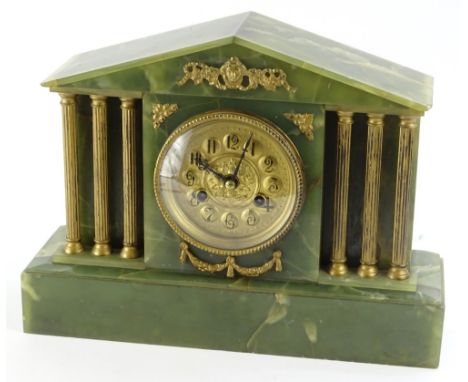 A late 19th/early 20thC French green onyx mantel clock, modelled in the form of an ancient portico with readed gilt metal pil