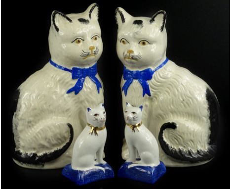 Two pairs of ceramic cats, to include a Staffordshire type, taller figures, 20cm H, and a pair of Royale Stratford examples, 
