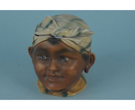 A vintage ceramic child head tobacco jar