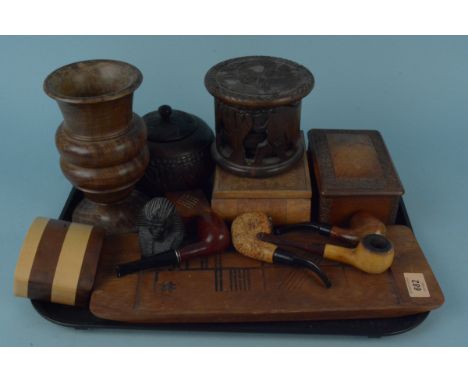 A selection of turned wood, a treen vase and boxes, tobacco jar, various pipes etc