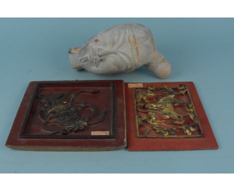 An unglazed Chinese terracotta head in the Terracotta Army style plus two Chinese wooden plaques painted red with applied gil