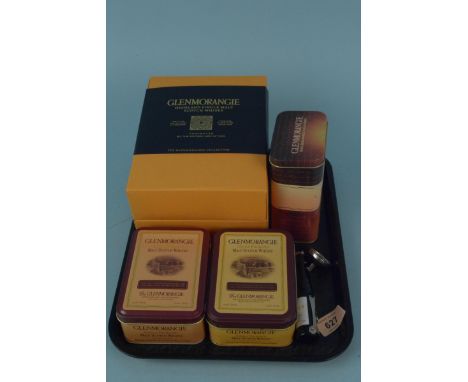 A boxed collection of four Glenmorangie whisky miniatures (10cl) plus three tins